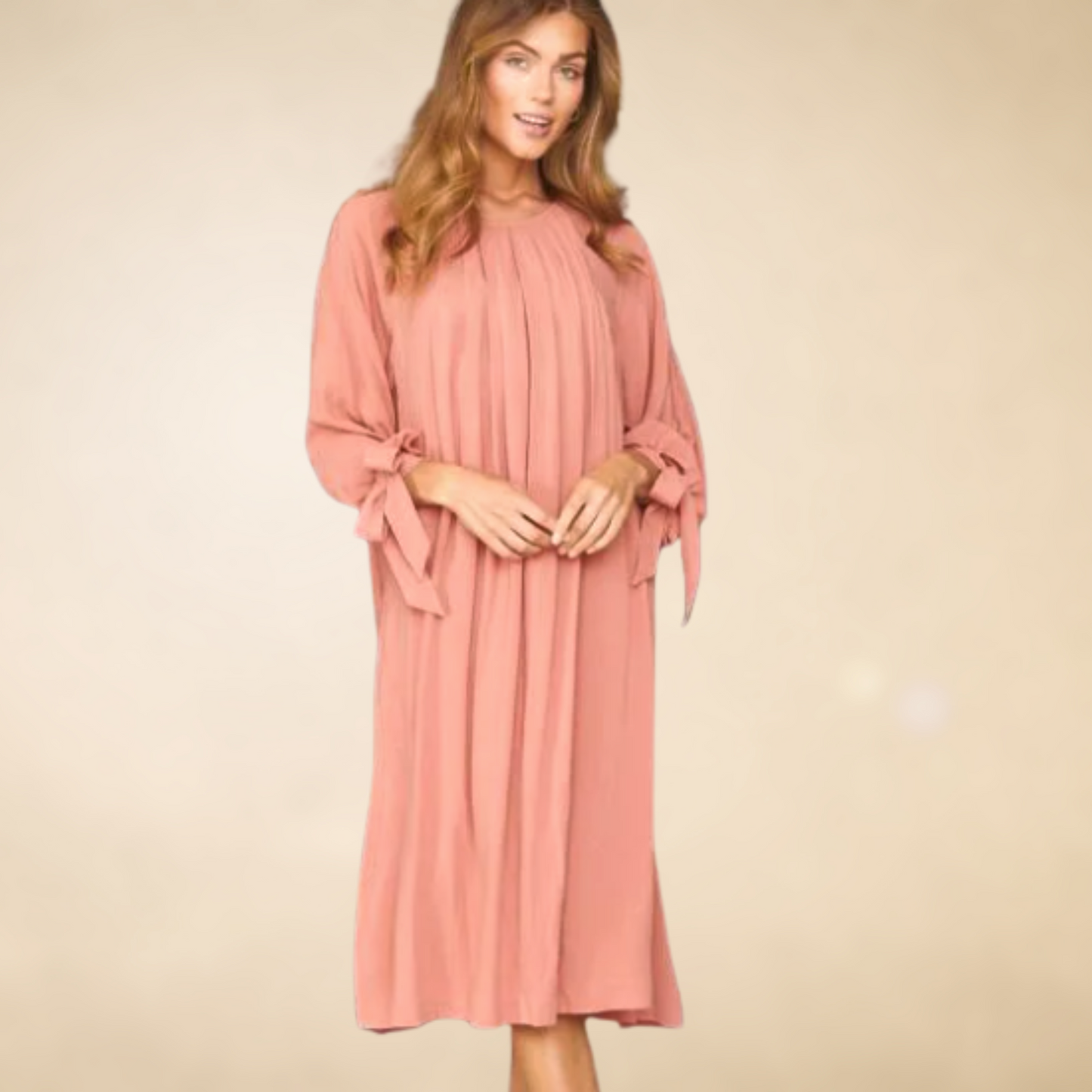 Mauve pleated front dress with long slleves that have functional bows at the wrist below the knees hem with slits onthe sides.