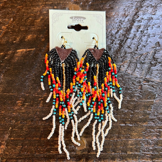 Trendy intricate western seed bead and semi-leather base drop earrings. Approx. 4" L x 1.25" W Black multi-color