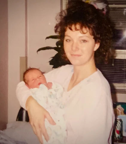 Picture of Rebecca holding Emily as a baby